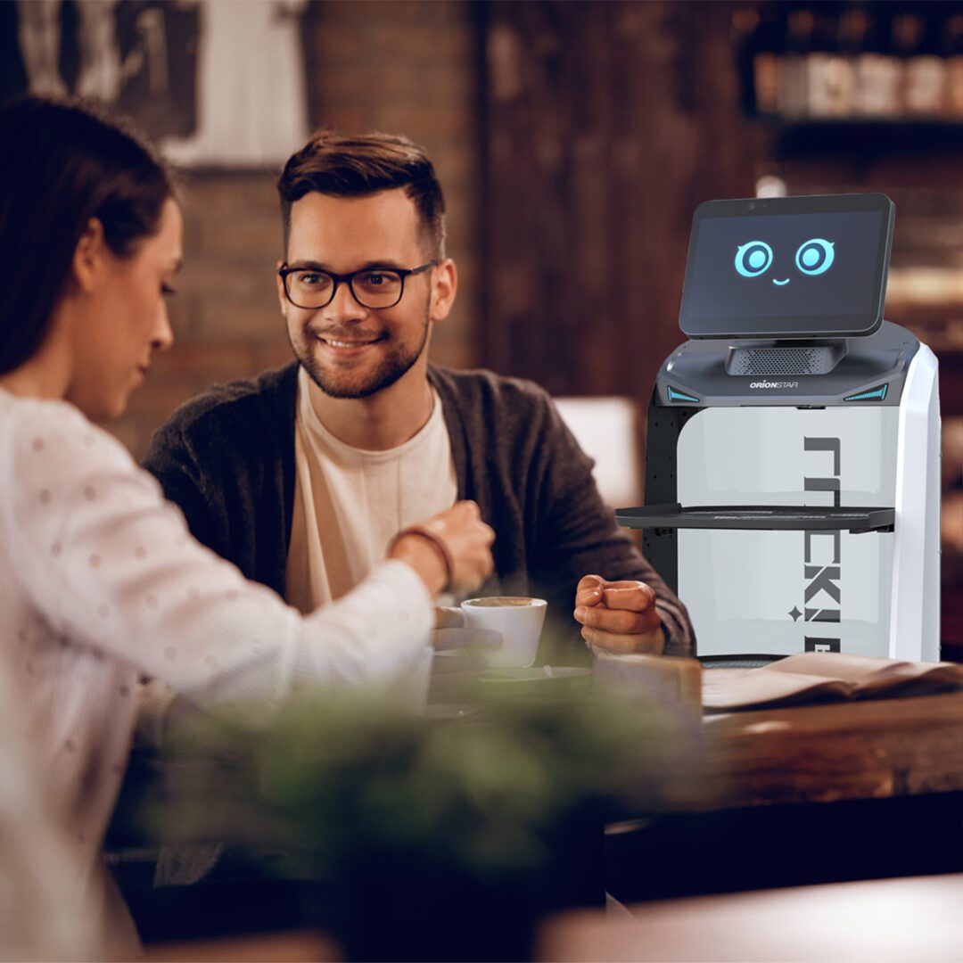 Lucki robot waiter in cafe with employee